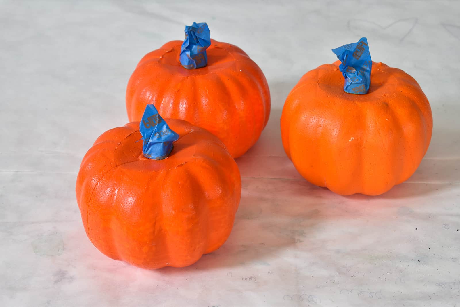 tape the stems of foam pumpkins