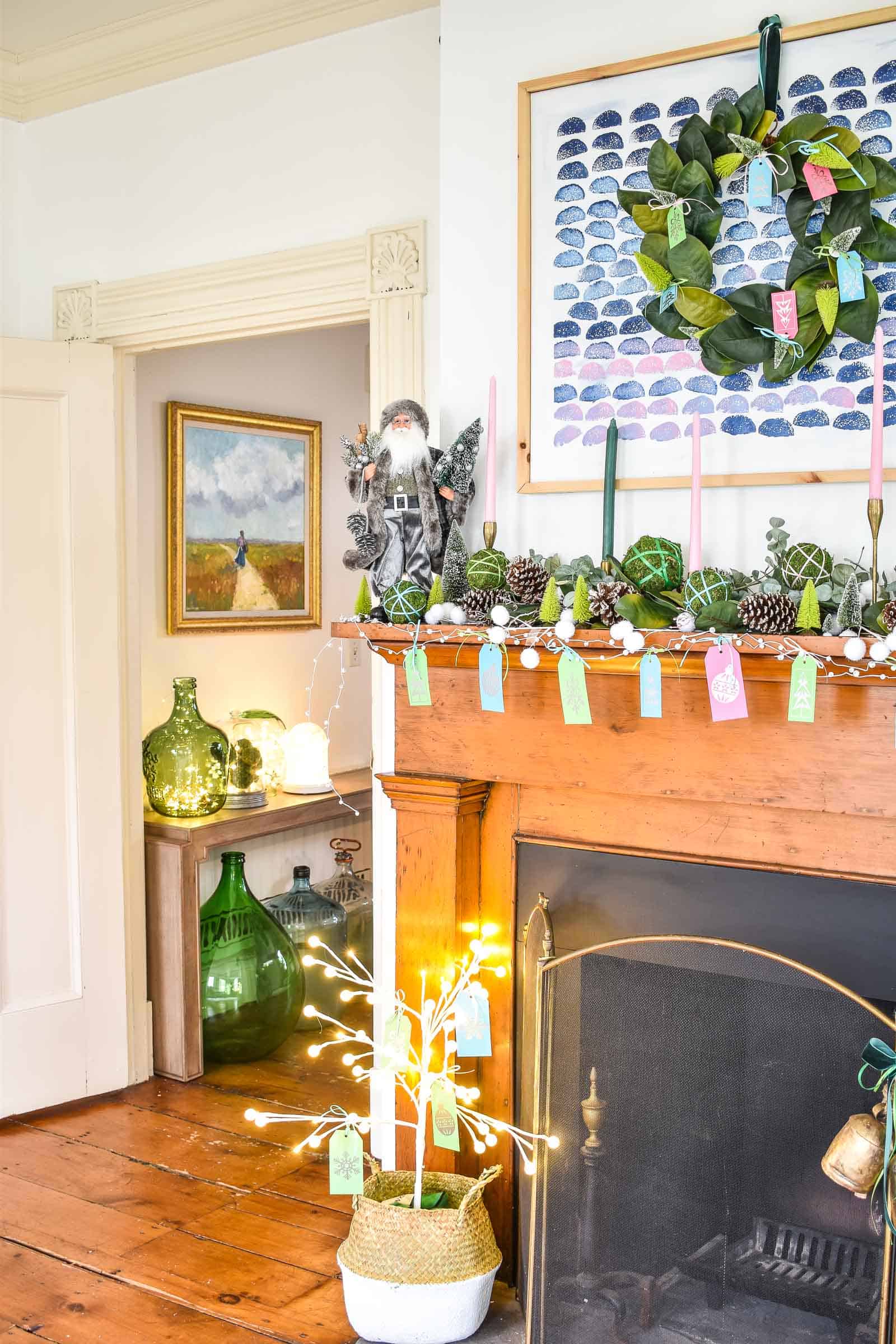 decorating a christmas mantel with greenery and color