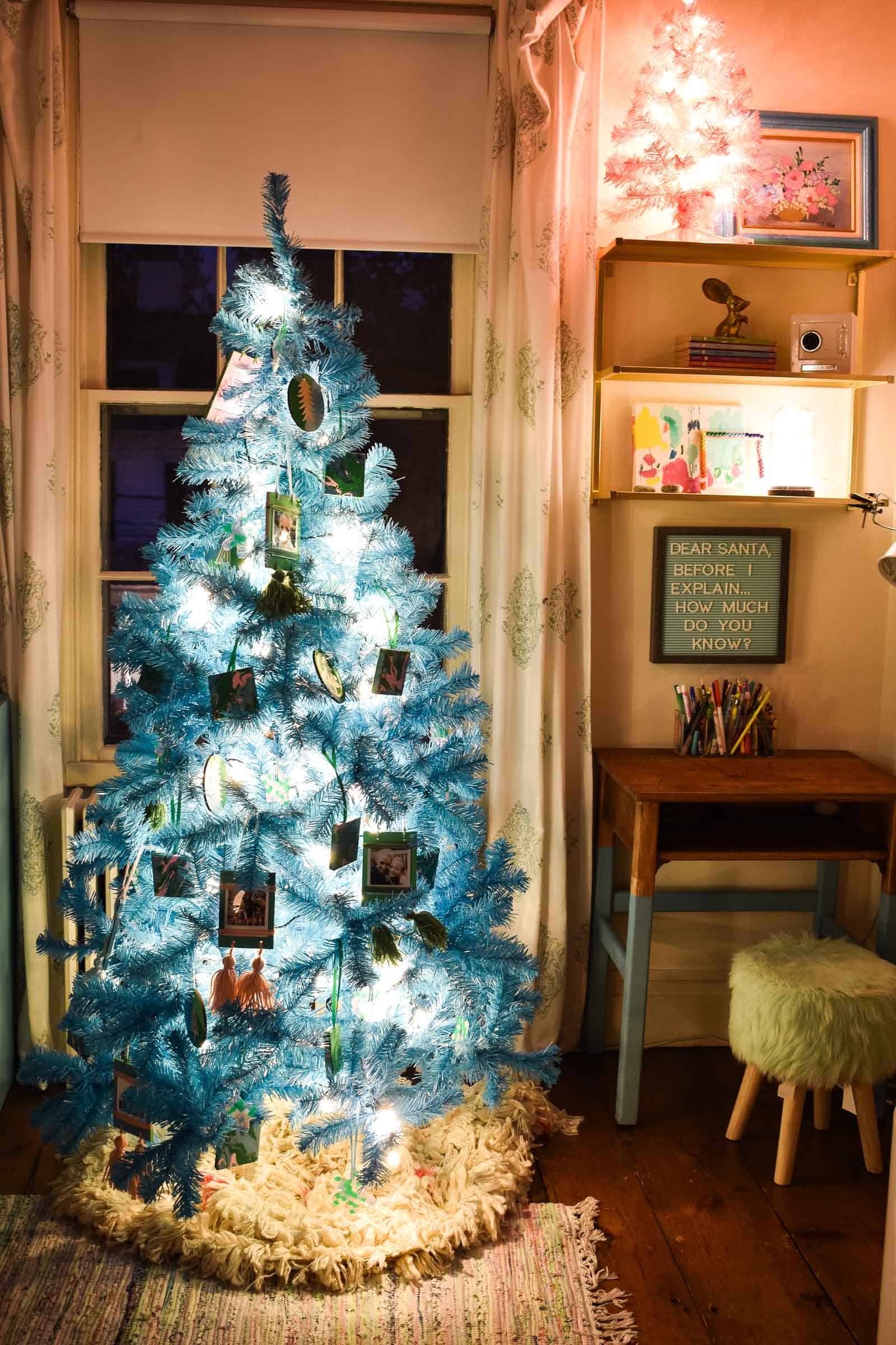 blue and pink christmas trees at night