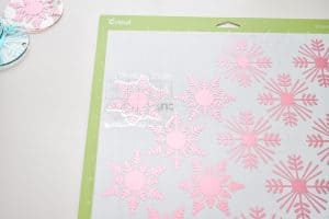 place transfer tape on vinyl snowflake