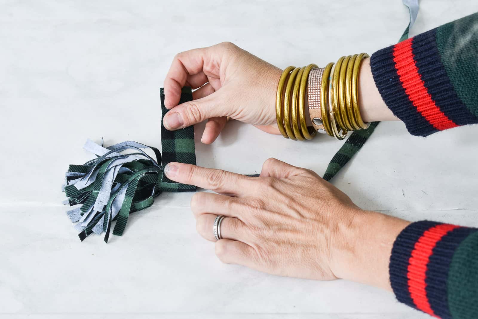 cut a strip of fabric to cover the top of the tassel