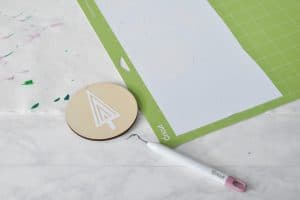 make a stencil and place it on the ornament