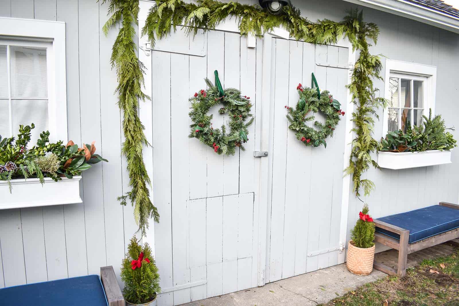 cedar garland on shed for holiday