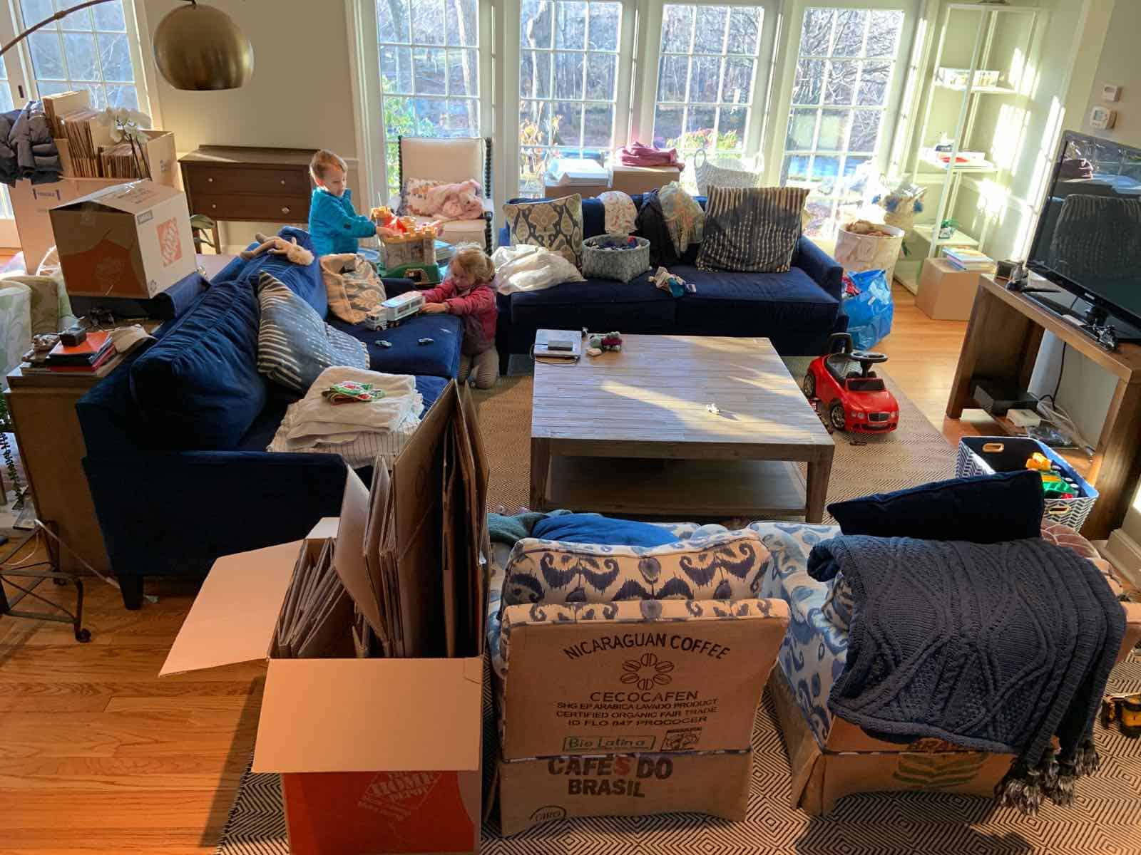 piles of boxes in family room