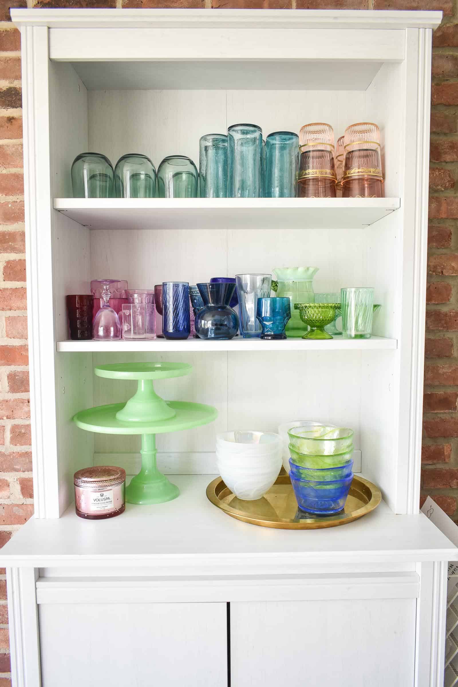 glassware on white shelf