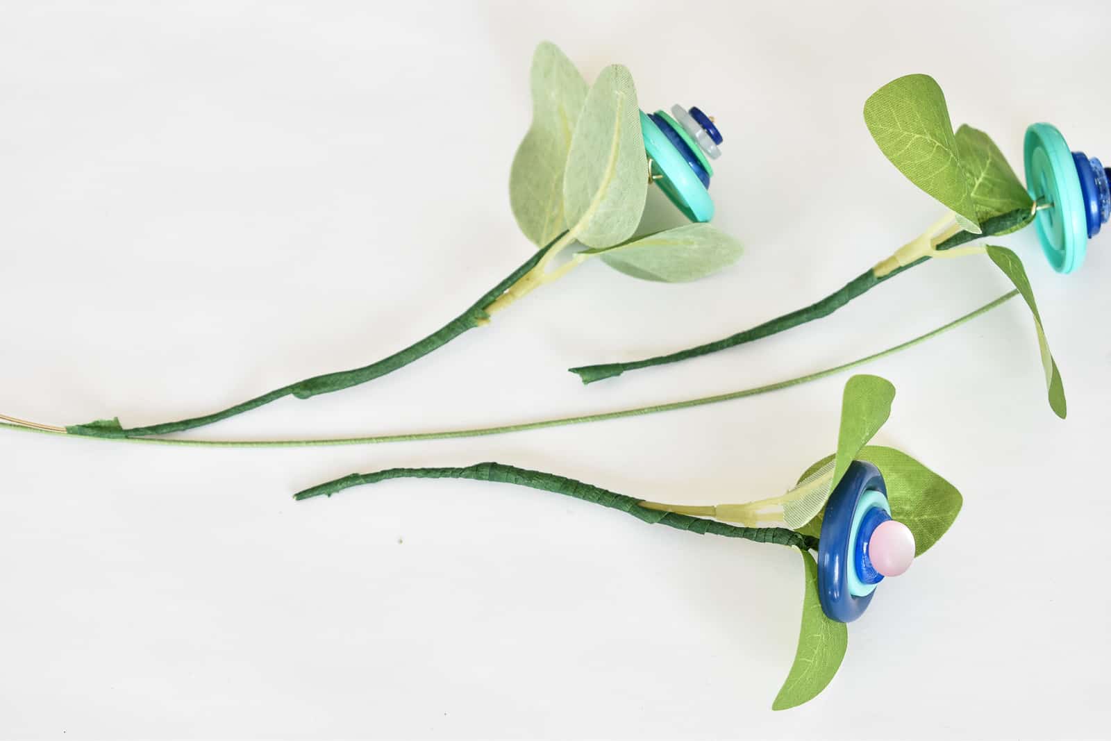 add individual stems to floral wire to make full button flower