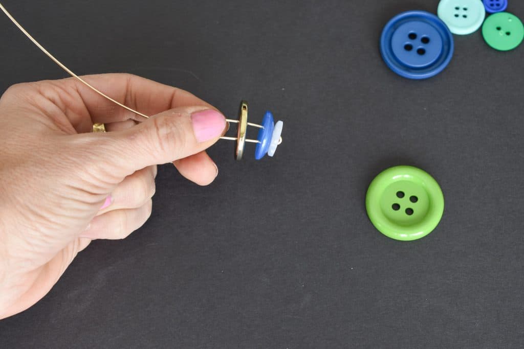 thread buttons onto wire
