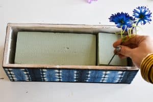 use floral foam inside the planters