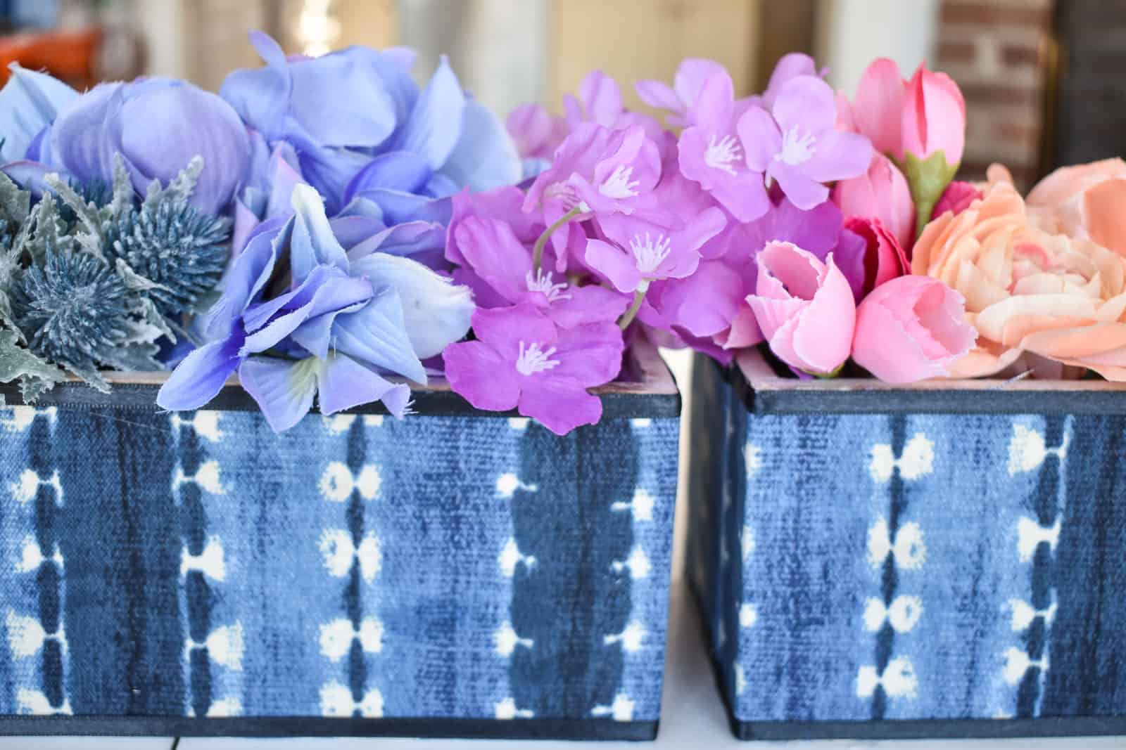 indigo planters with rainbow flower arrangement