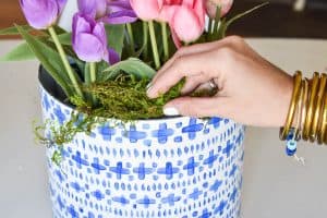 add moss to cover floral foam in planters