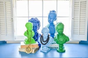 spray painted busts in office makeover