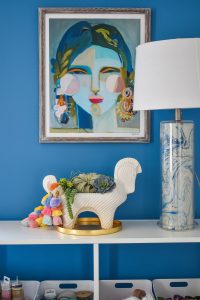 shelfie vignette in blue colorful office