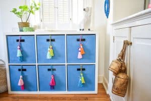 repainted storage bins with homemade tassels