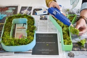 use hot glue to keep moss in
