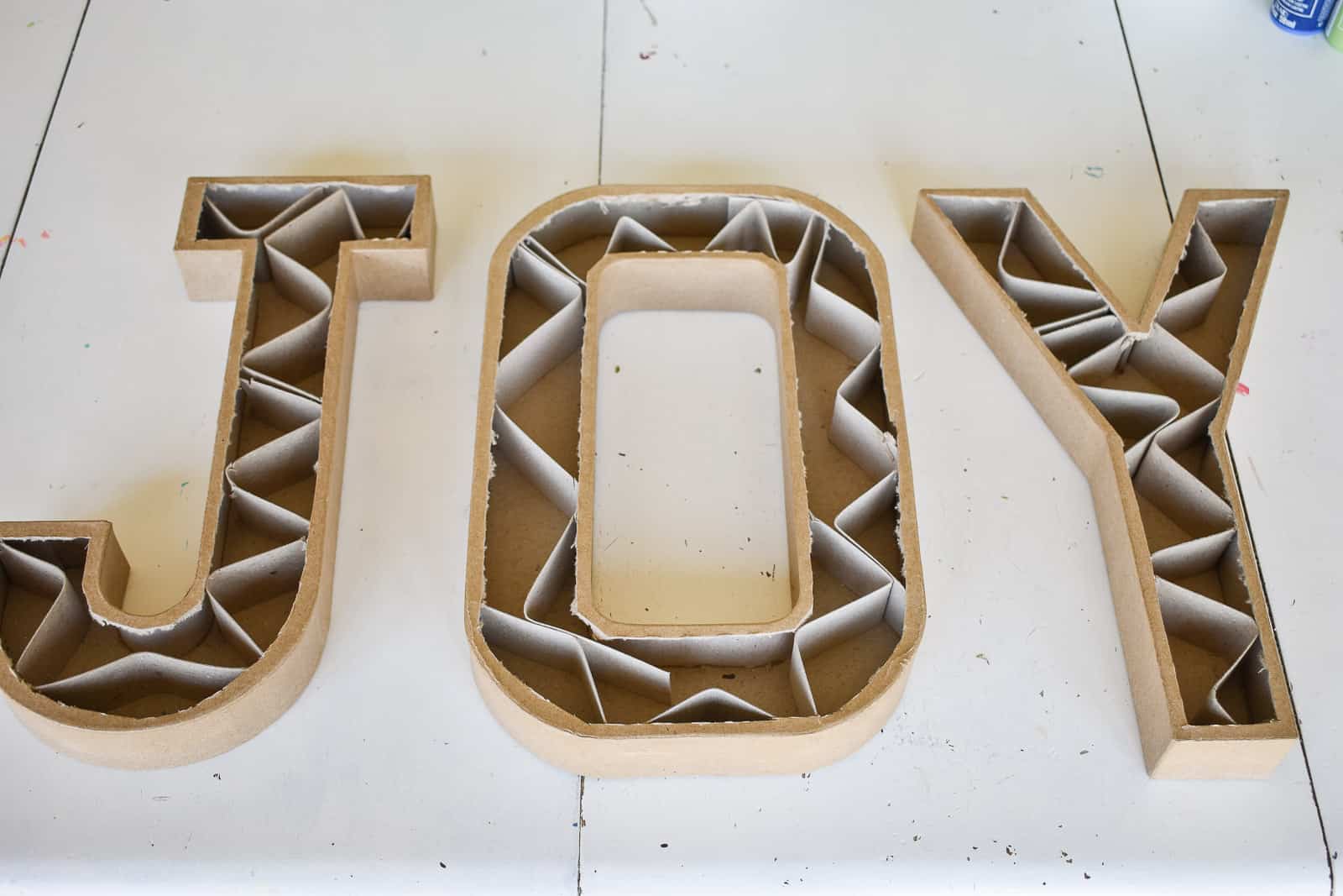 remove inside cardboard of paper mache letters