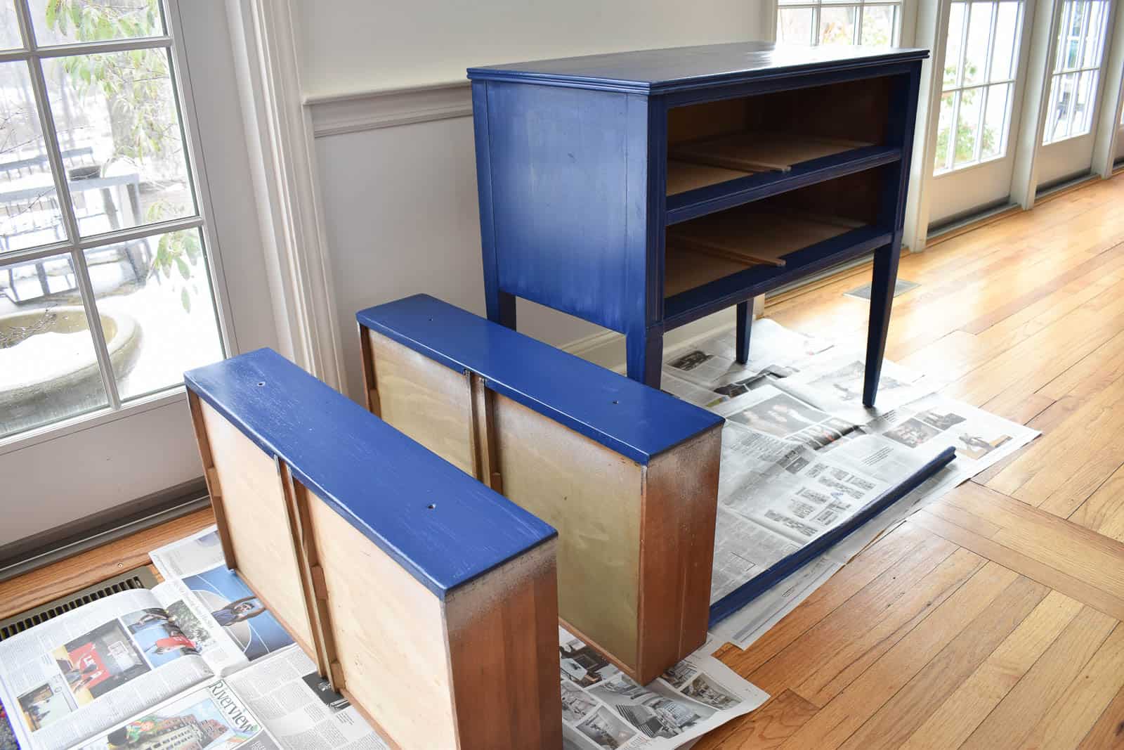 three coats of blue paint on table