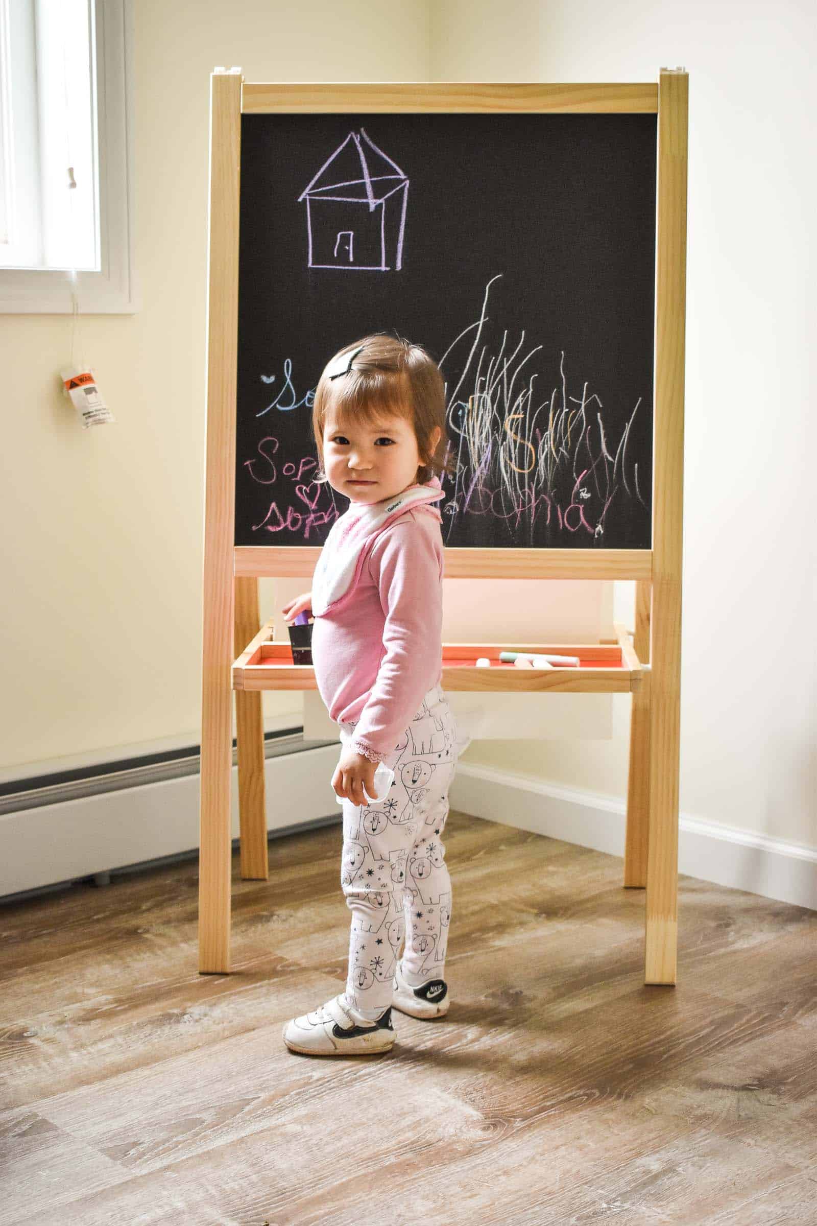 little girl enjoying the easel