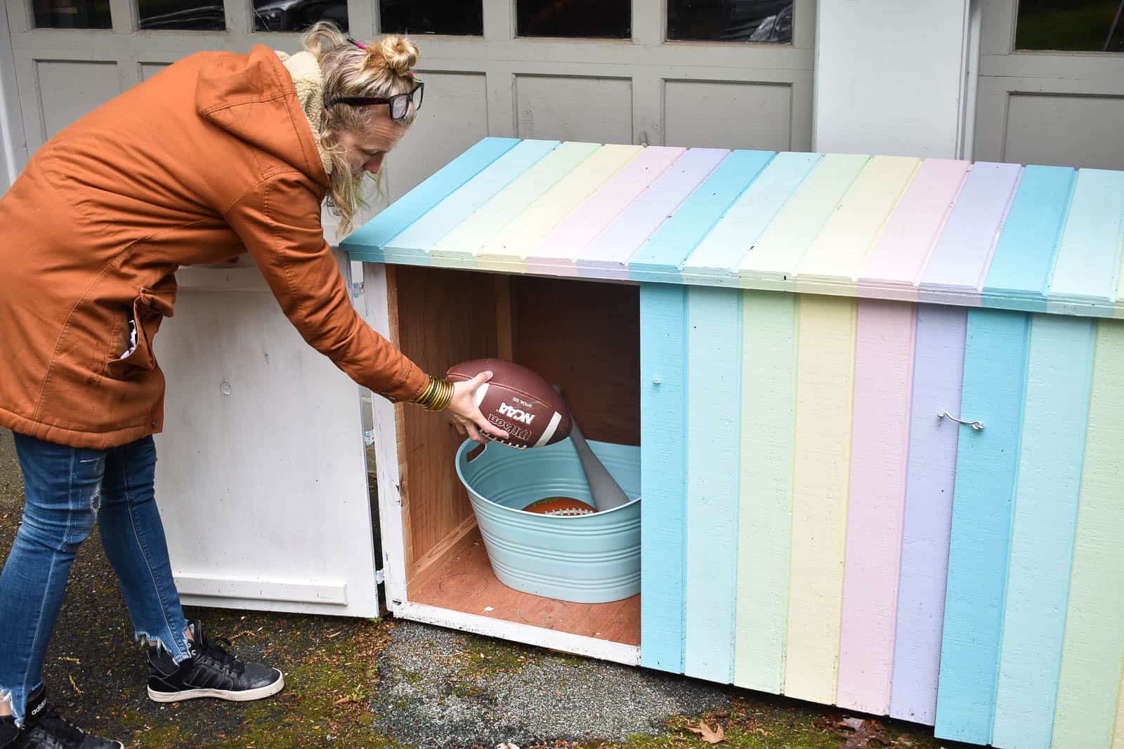 hiding outdoor toys in trash can shed