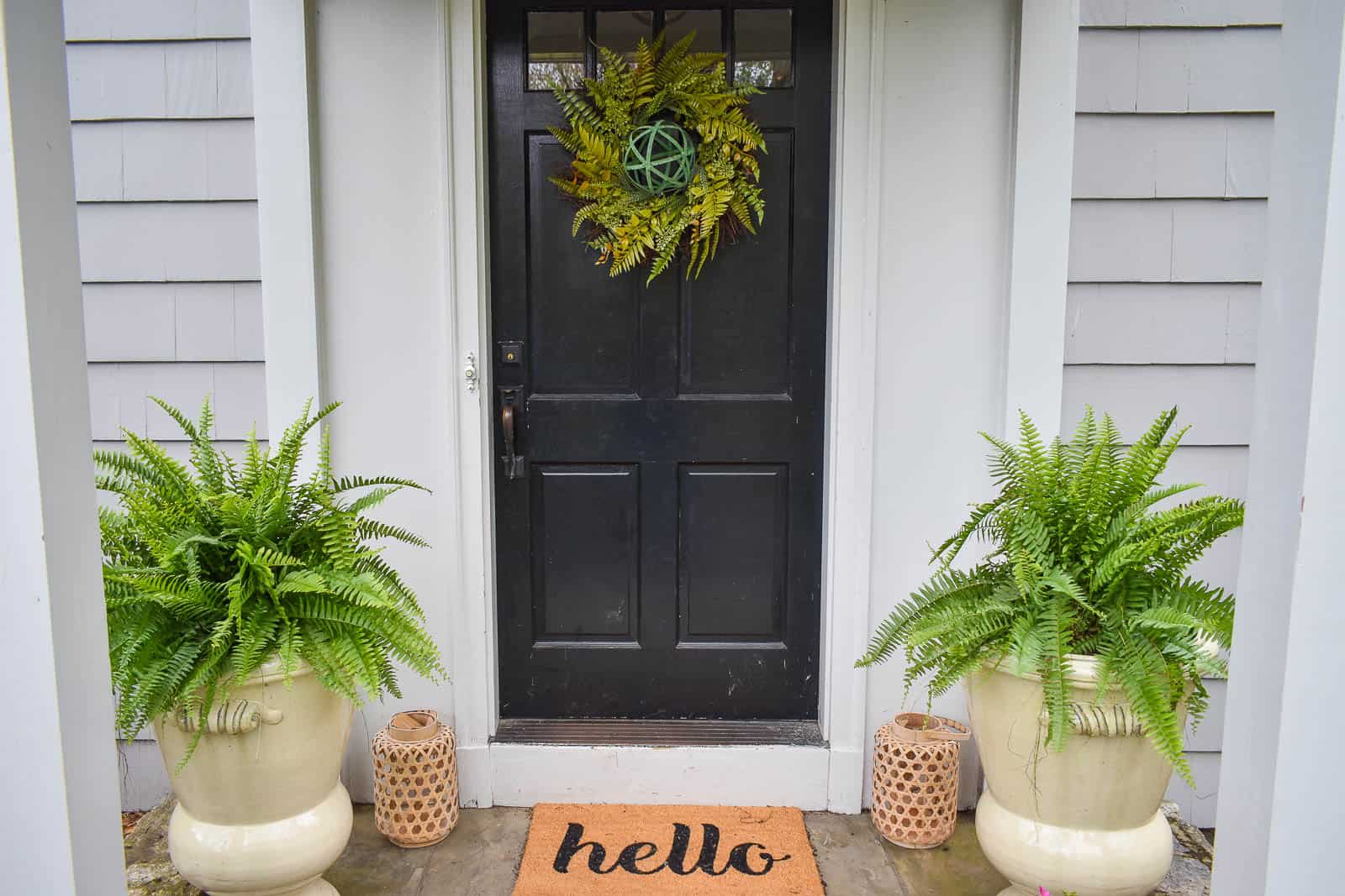 fern wreath on black front door