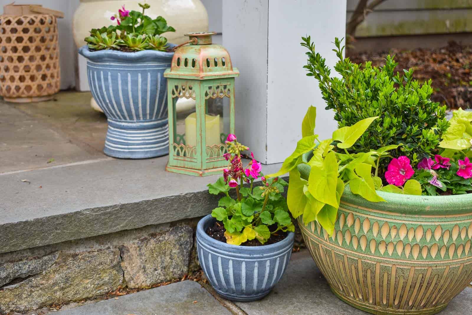 gray planters paired with green planter