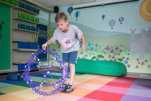 children enjoying a library maker space