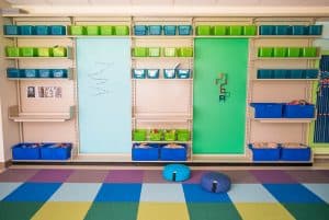 bins and contact paper on library STEAM shelves