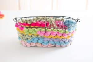 continue weaving the yarn around the basket