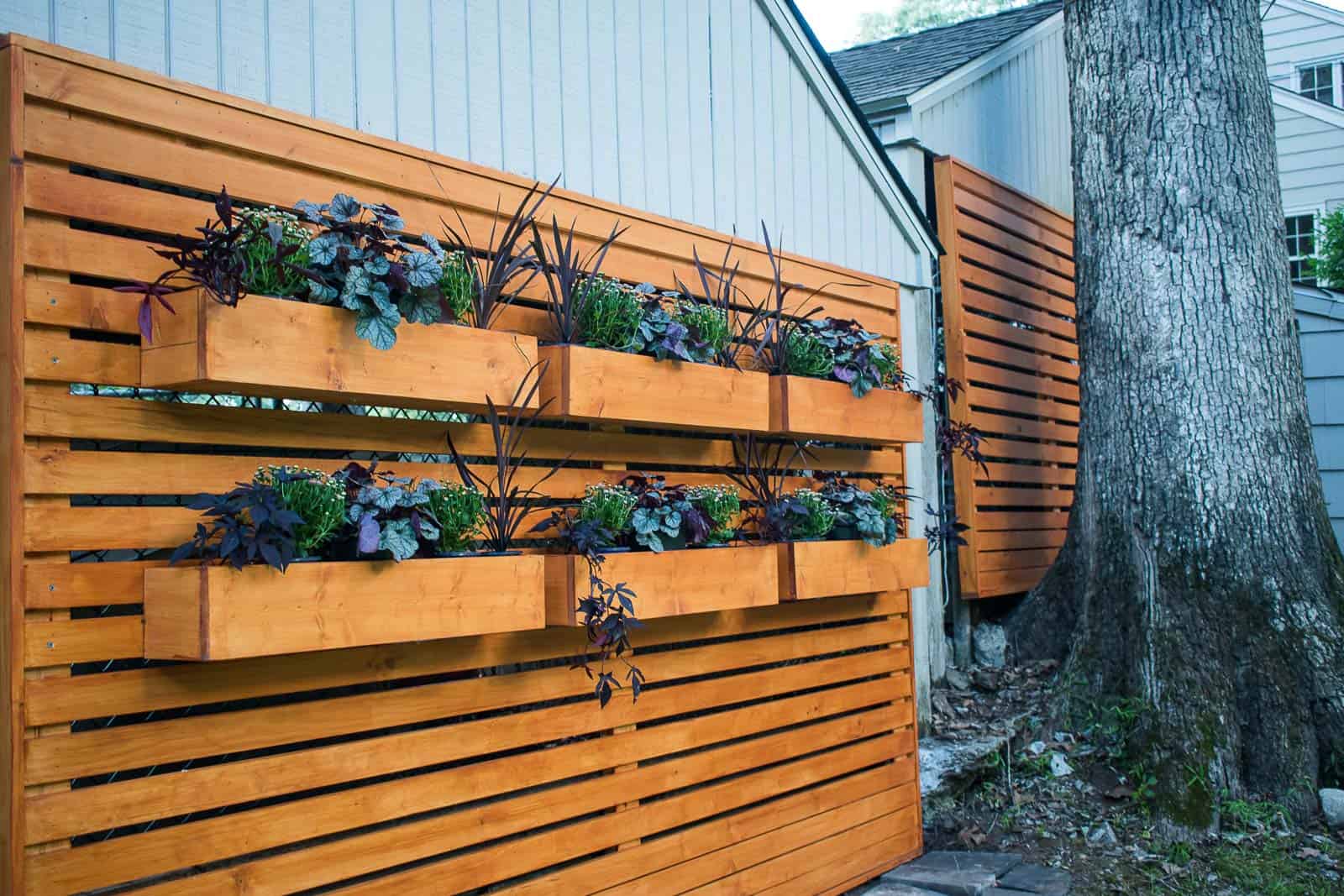 planters mounted on the wooden chain link fence cover