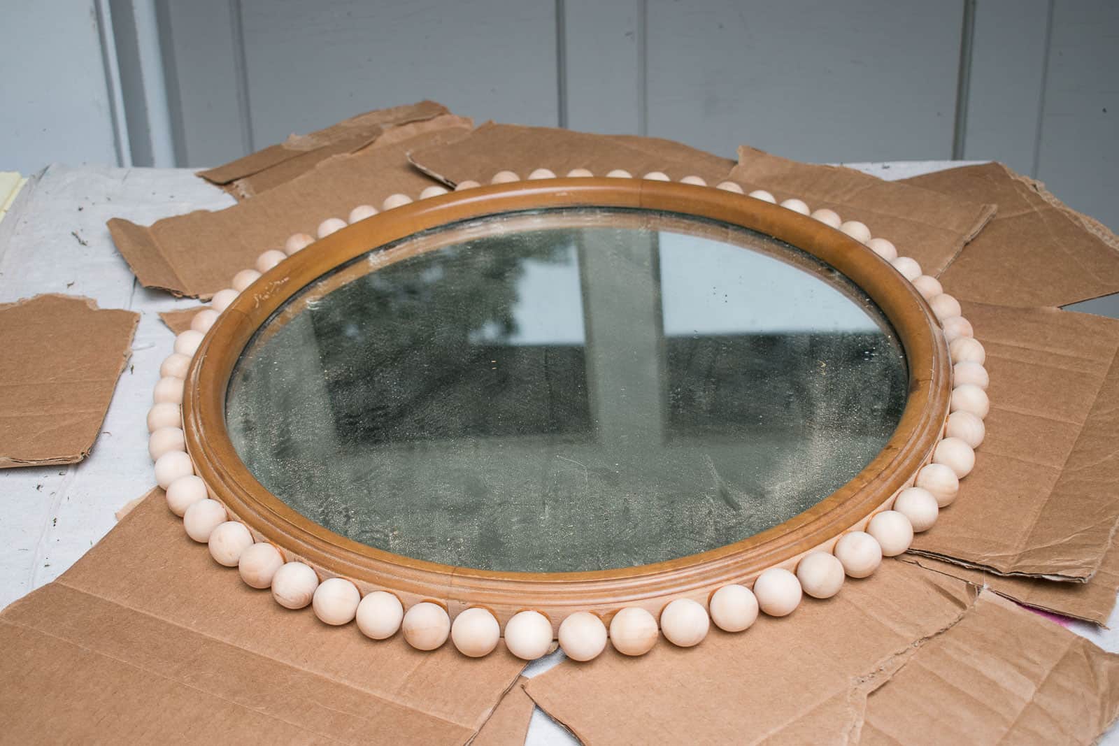 round mirror with balls around it