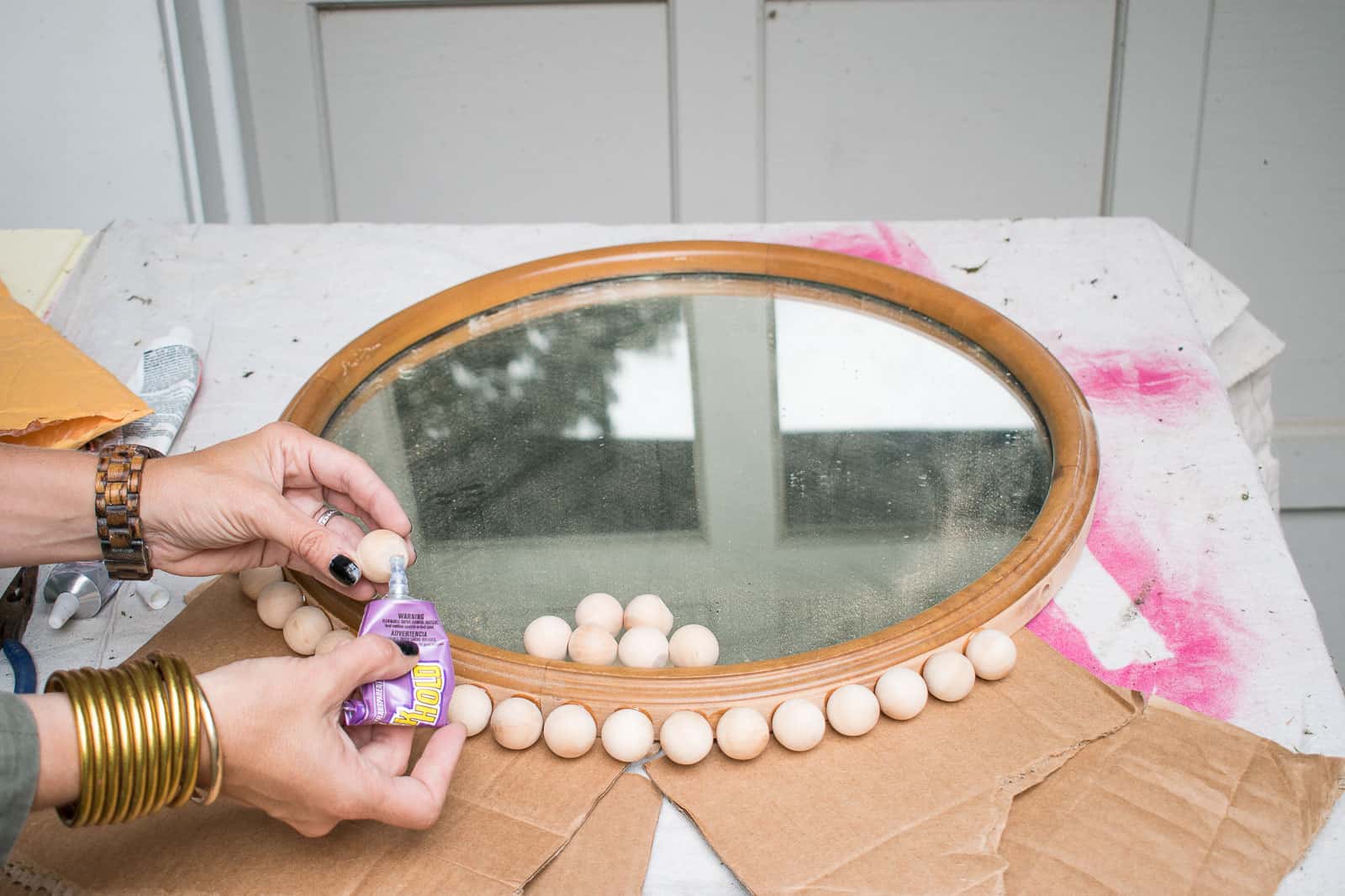 glue the balls onto the mirror