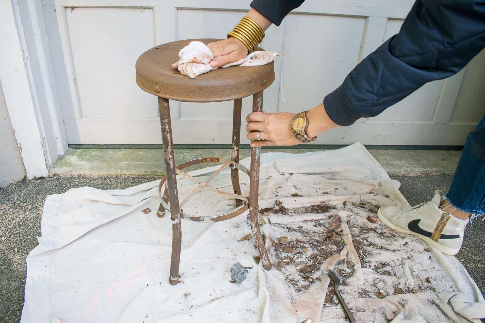 prepping surface of rusty stool