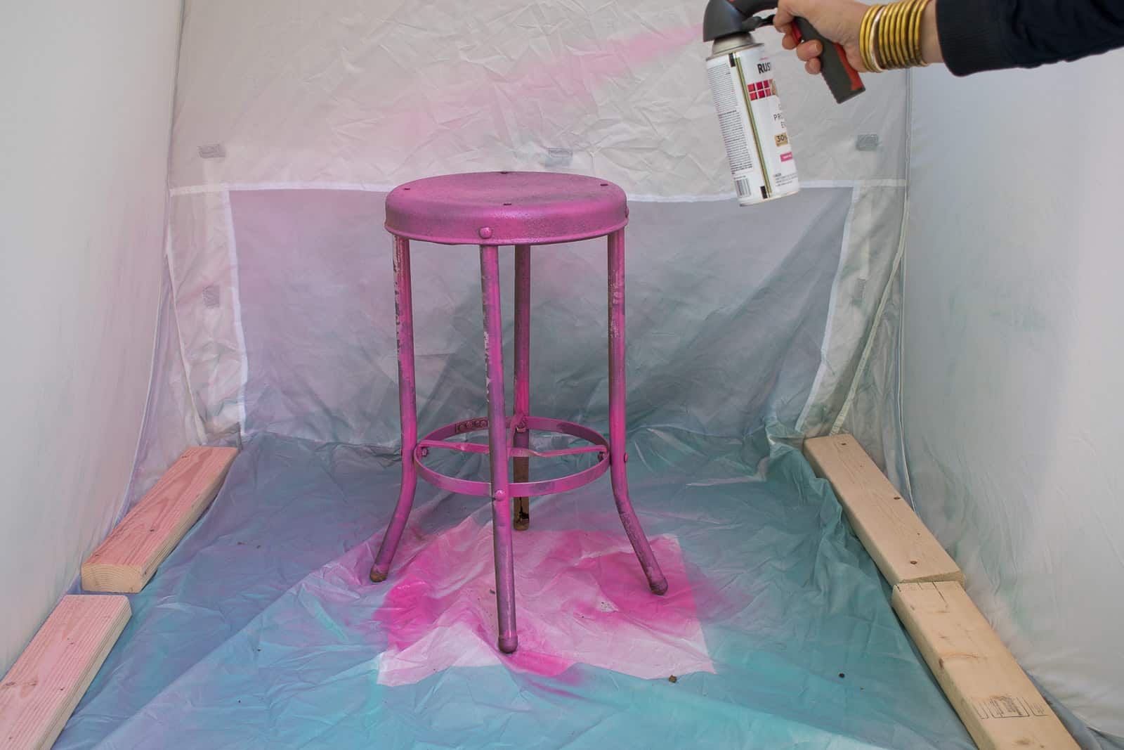 spray painting metal stool