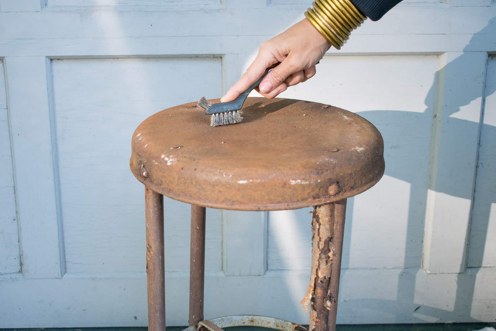 wire brush to metal stool