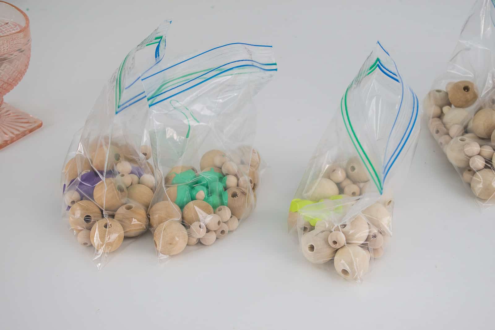 place beads and paint in plastic bag