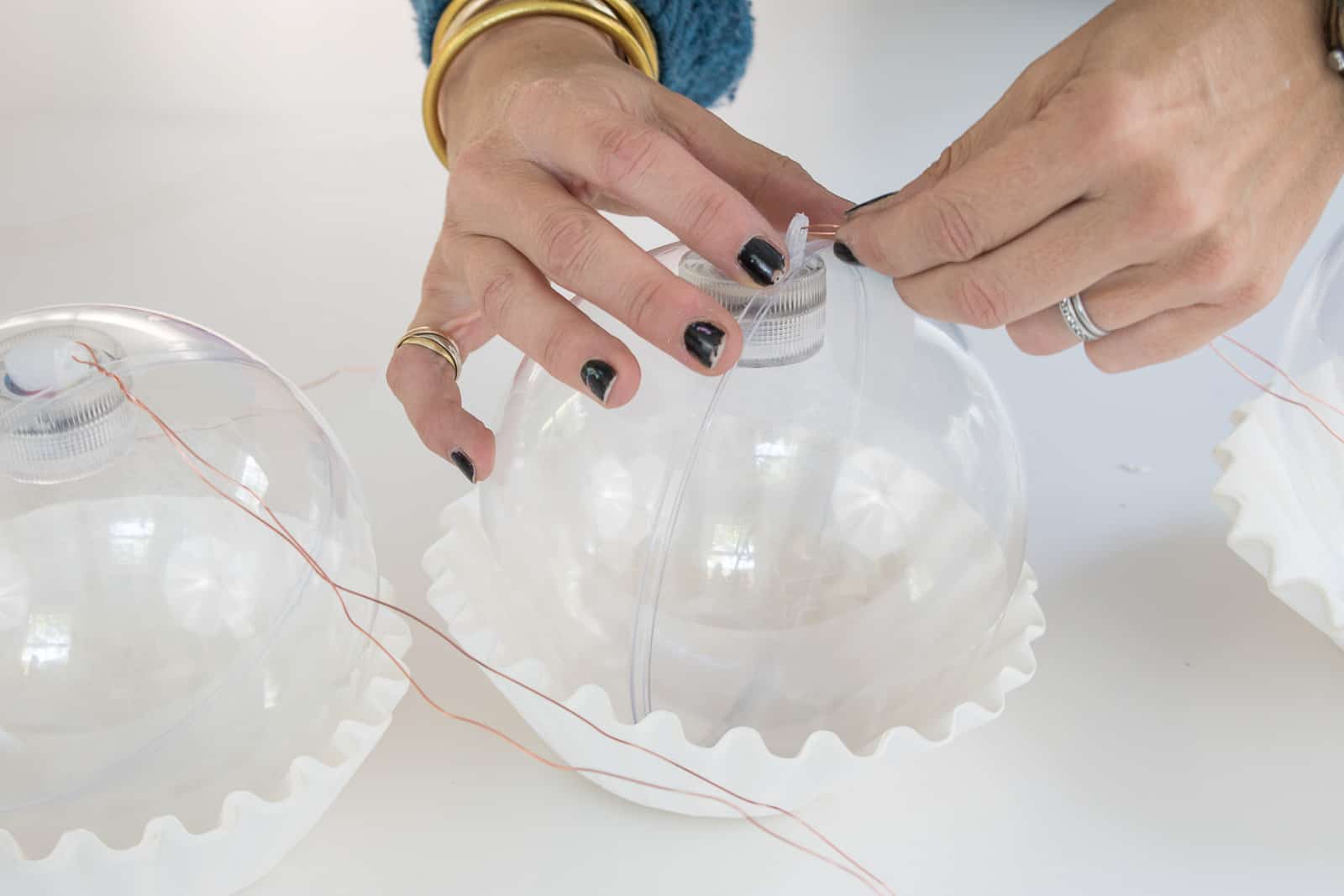 tie monofilament on each plastic orb