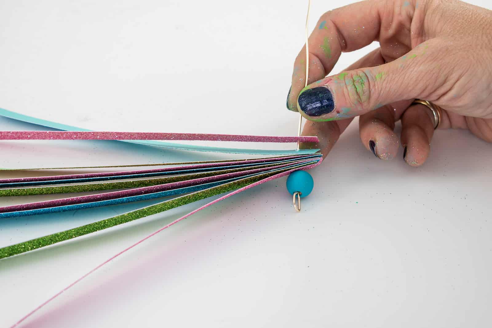 place paper strips onto the end of the floral wire