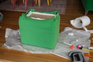slip the slipcover onto ottoman