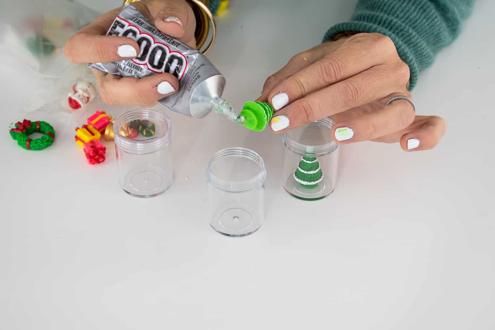 glue the plastic figure into the snow globe