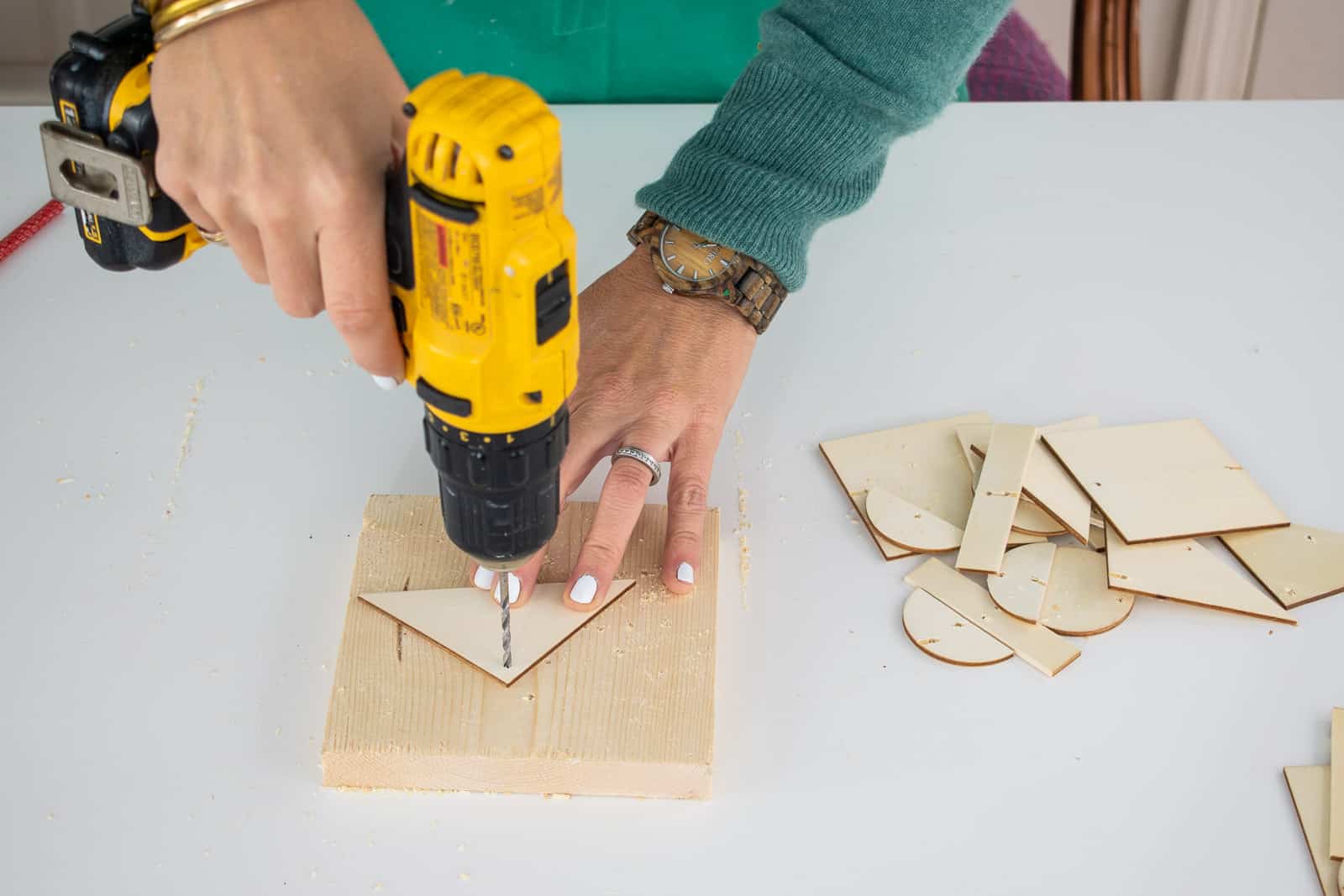 drill small holes through wooden shapes