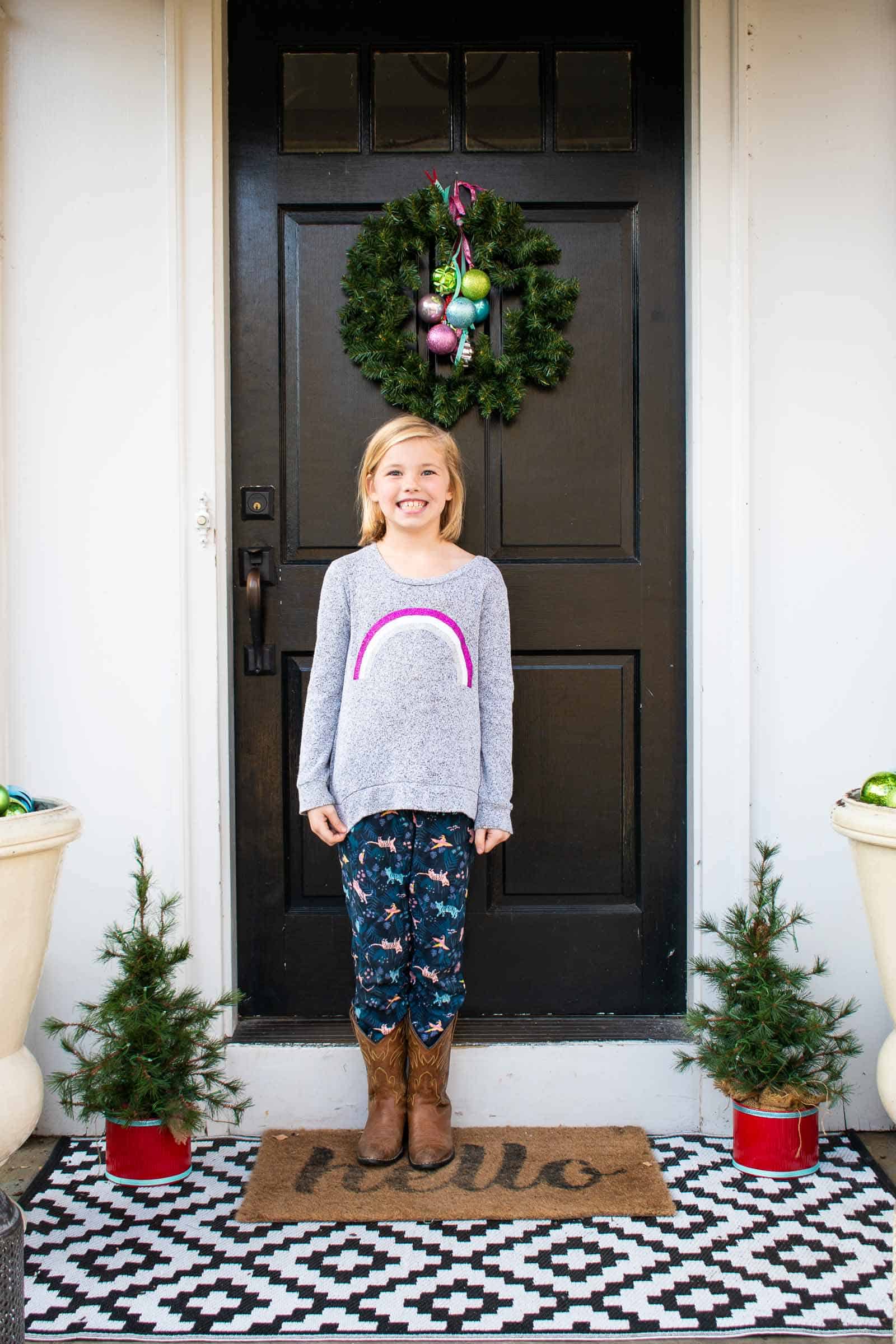 standing on front christmas porch