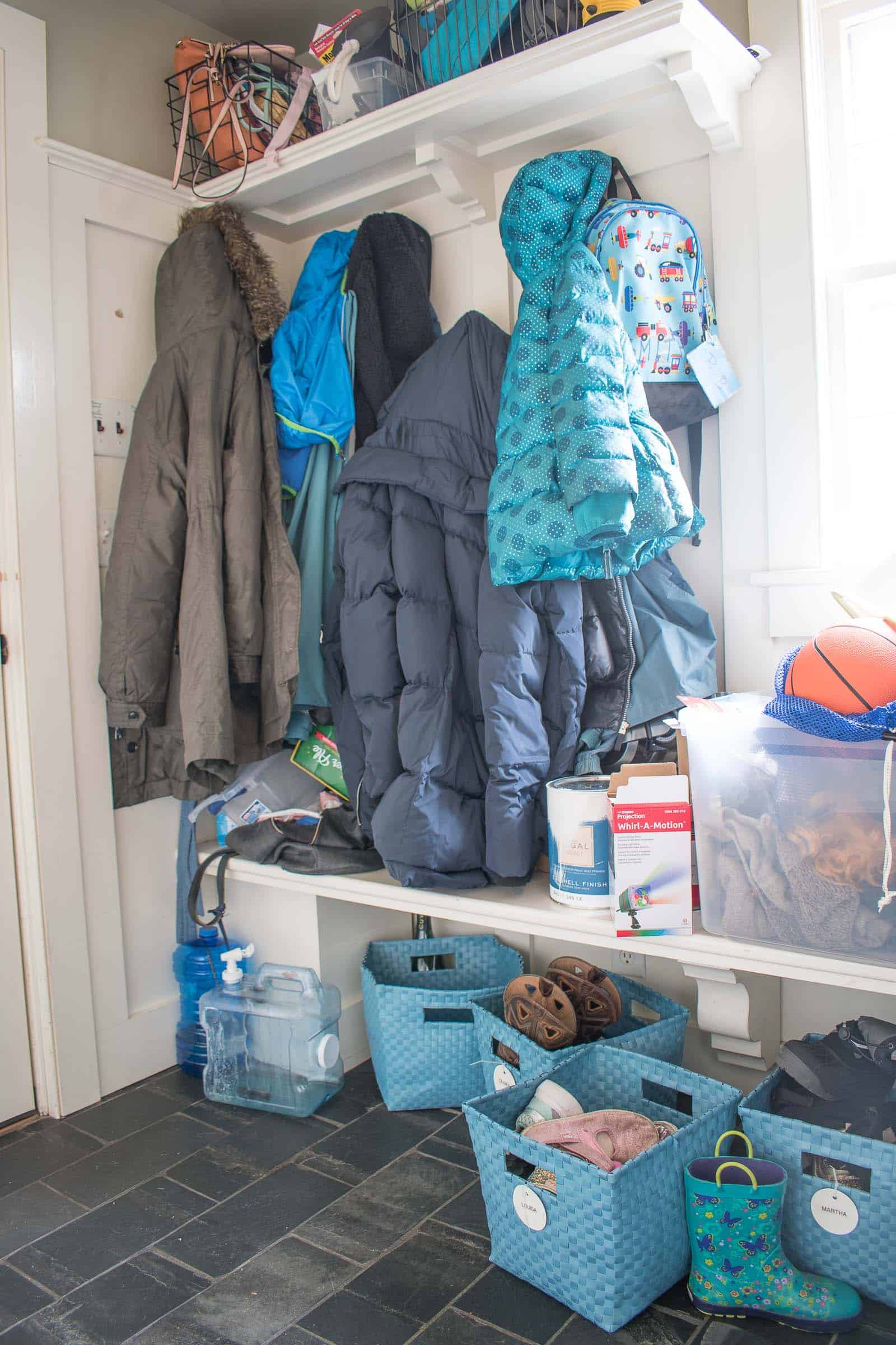 overflowing mudroom before