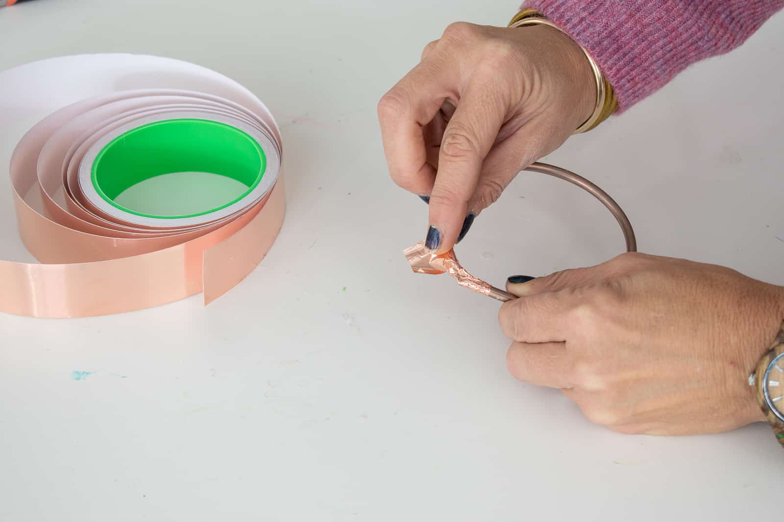 tape the ends of the copper circle together