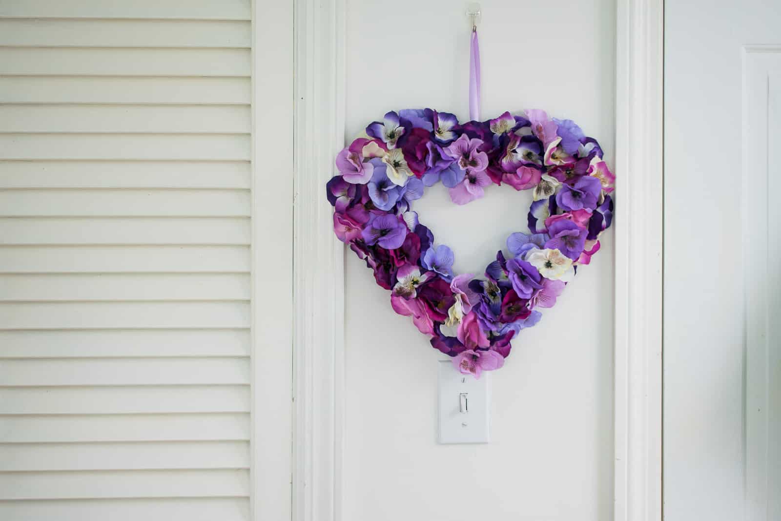 adding ribbon to floral wreath