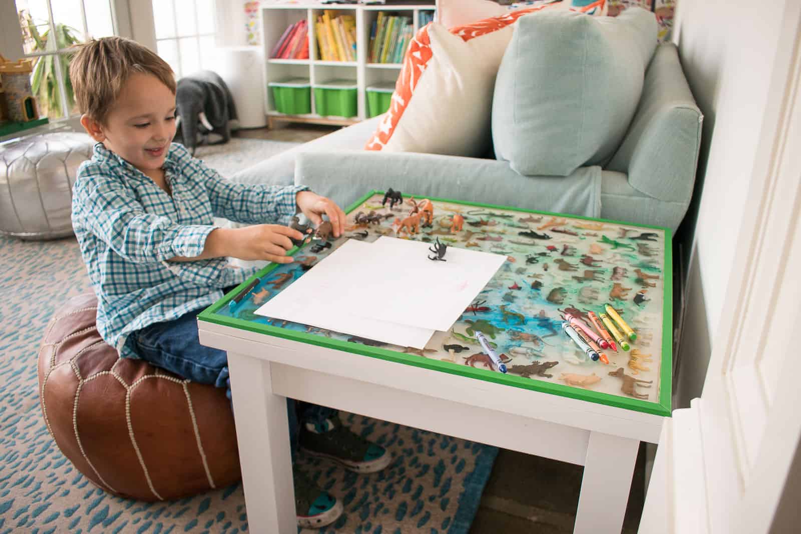 arthur playing at epoxy table