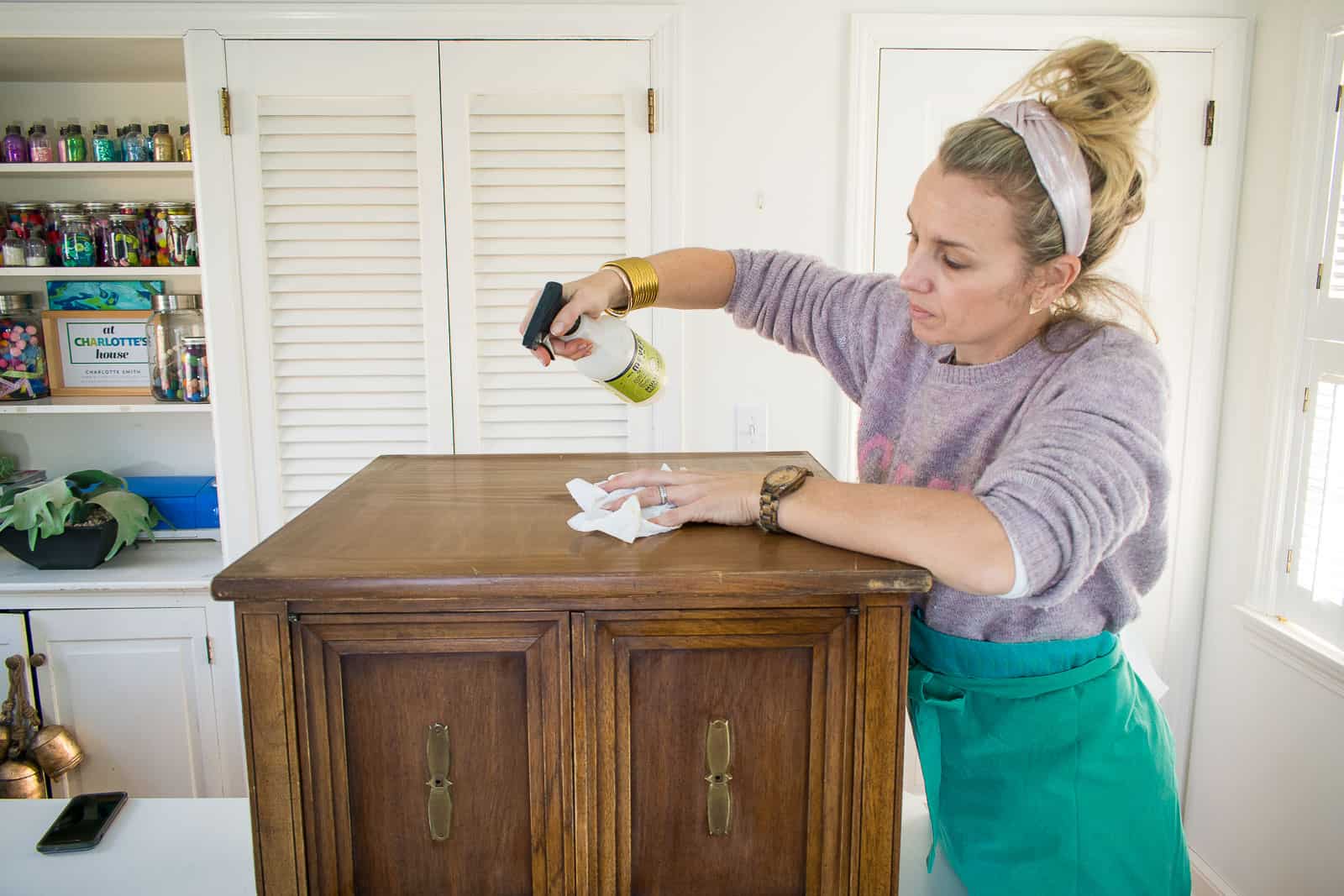 cleaning the surface of the wooden table