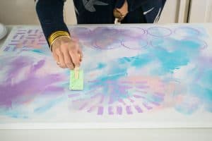using a sponge to add pattern to canvas