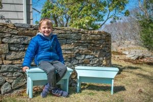 arthur sitting on farmhouse benches