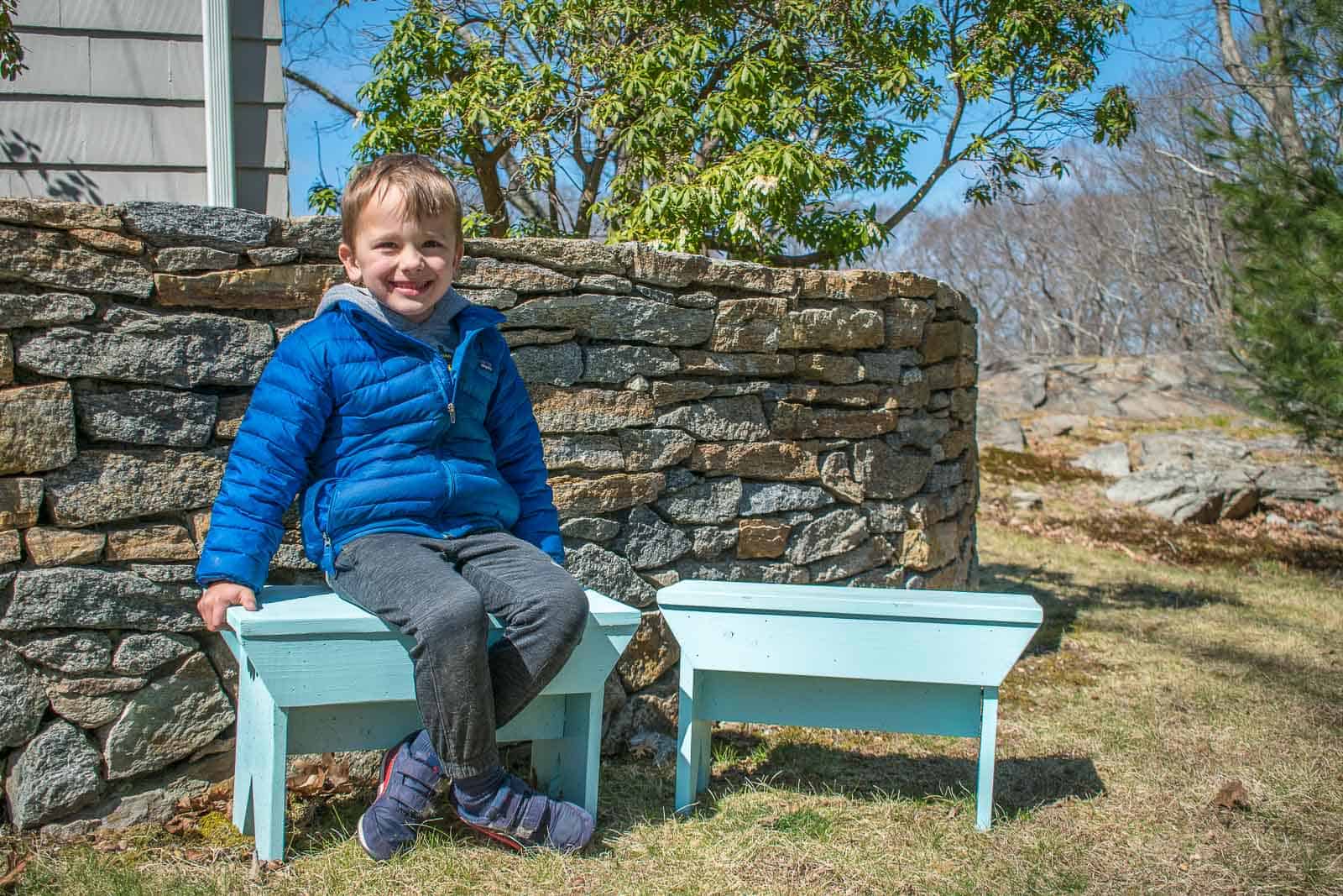 arthur sitting on farmhouse benches