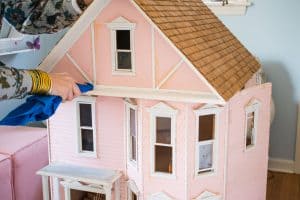 cleaning the dollhouse exterior