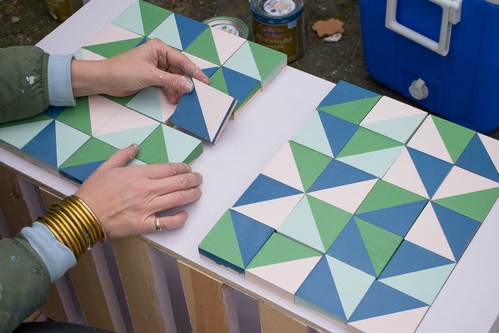 arranging the squares onto the wood box